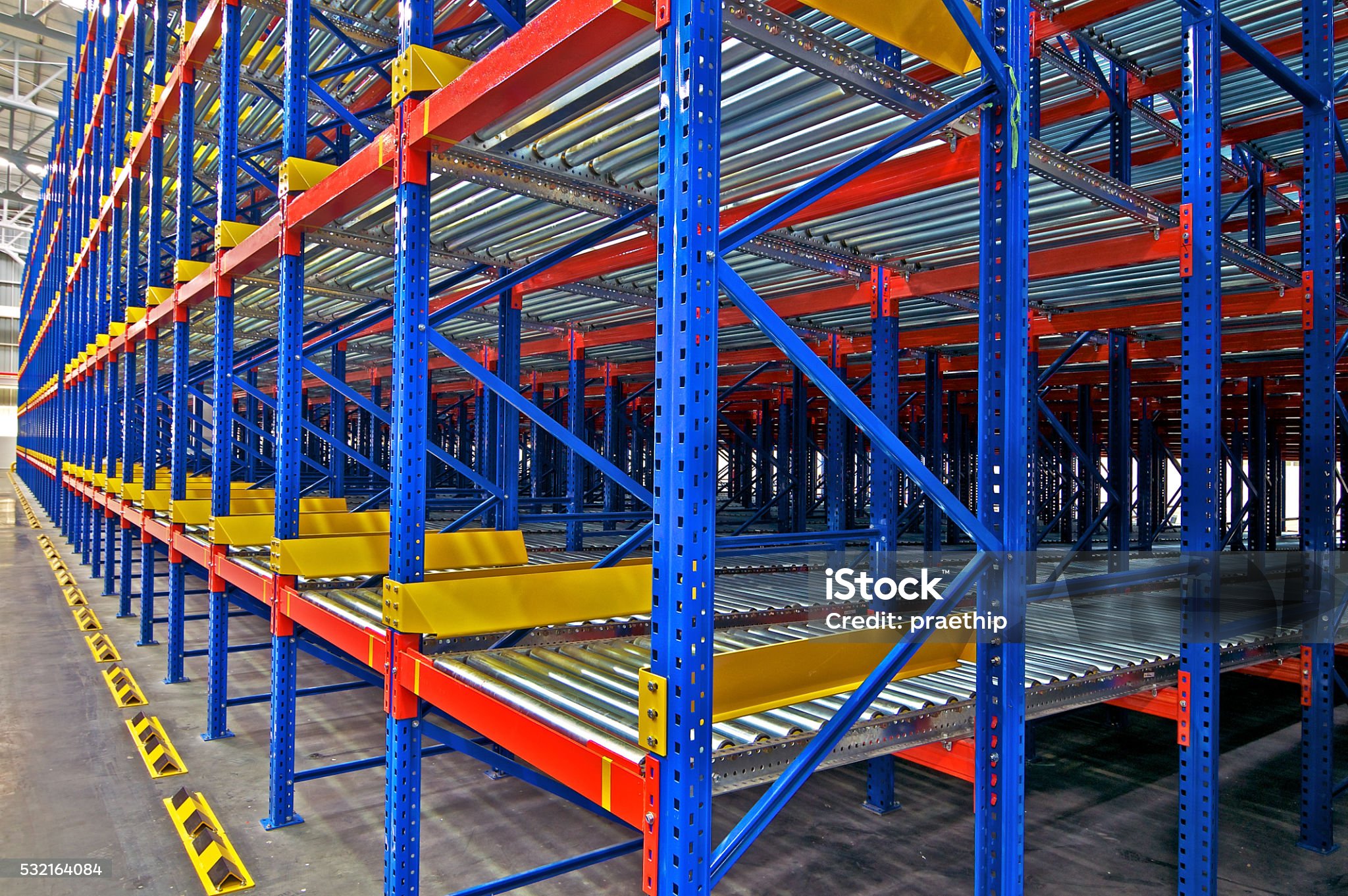 Empty push back racking system in warehouse facility.